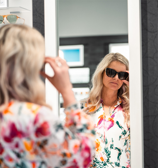 St Johns Eye Associates Patient Trying On Sunglasses